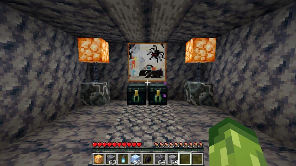 A room where the floor is made of regular basalt, the walls are made of smooth basalt, and a double roof-beam overhead is made from polished basalt. The room is furnished with gray glazed terracotta, shroomlights, chains, ender chests, and a painting of a spider.