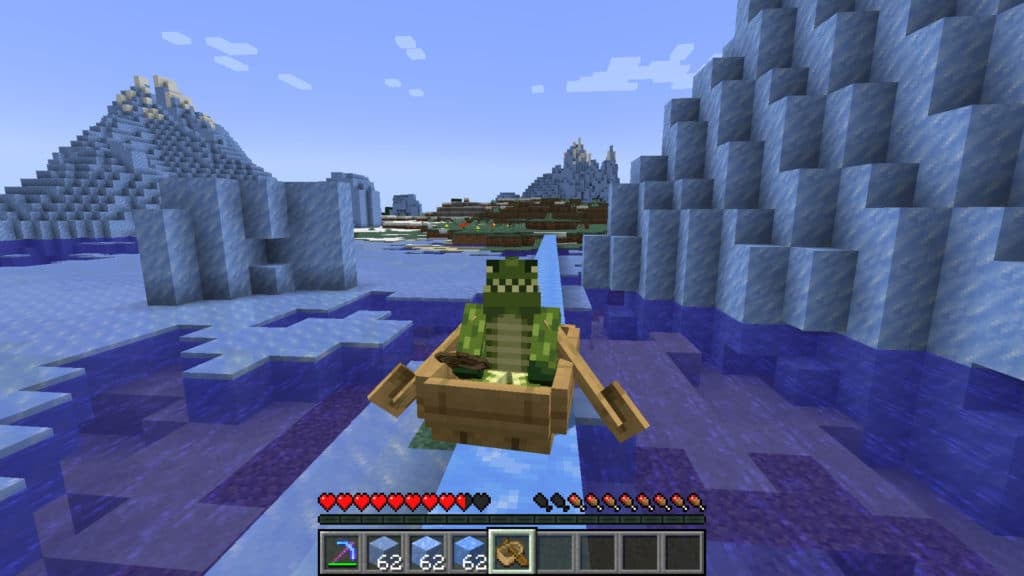 A player in a boat sliding across a slim path of blue ice. They are in third-person view and are looking at themselves.