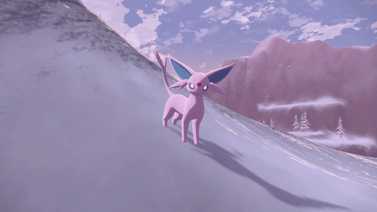 An Espeon standing on a snowy hill.