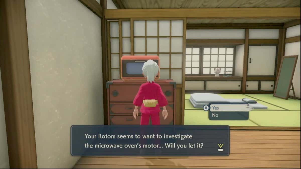 The player in their home looking at an orange microwave oven on a dresser.