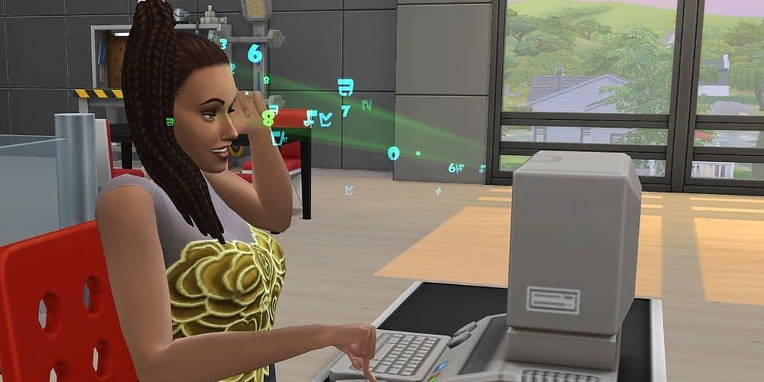 A Sim is using a computer in The Sims 4.