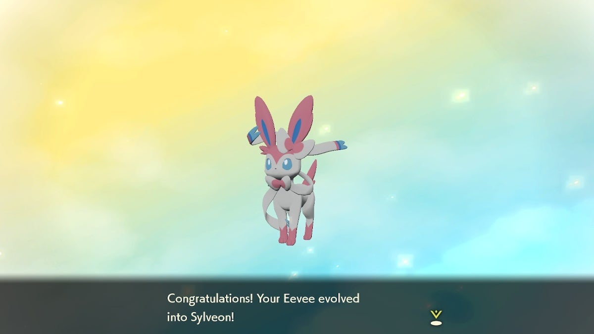 Sylveon is standing in front of a yellow and blue background with congratulatory text underneath them.