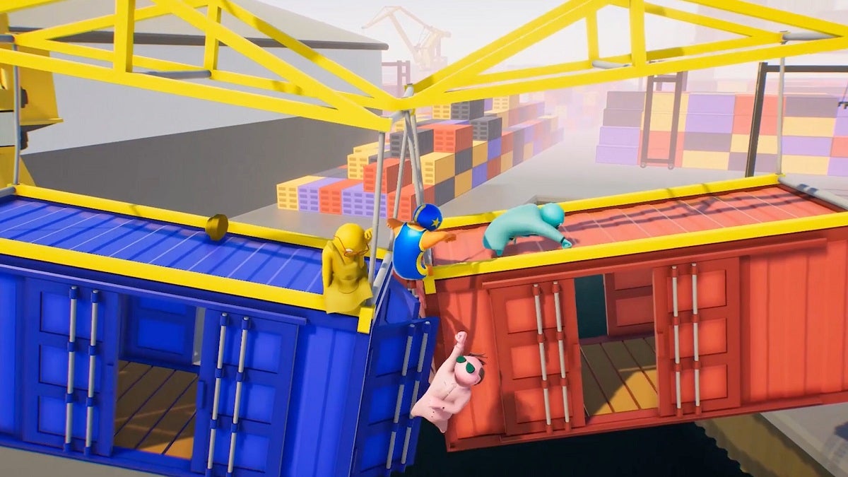 Players fighting atop a crane in Gang Beasts.