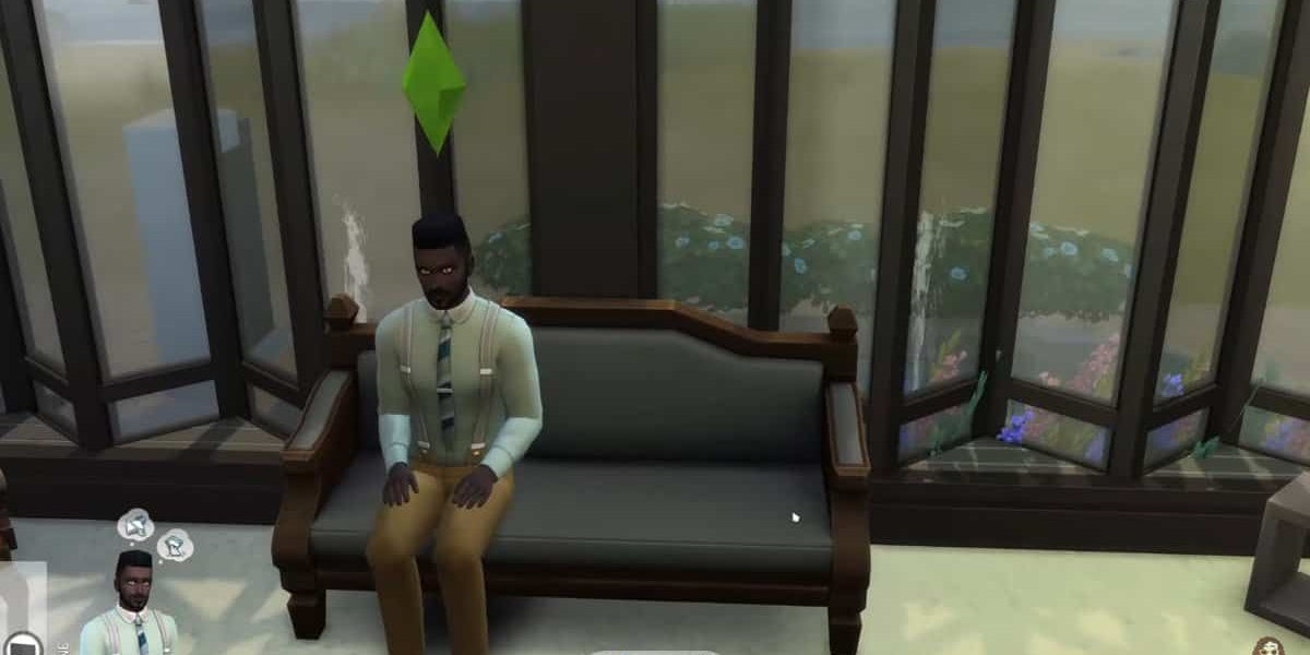 A Sim is sitting on a sofa in The Sims 4.