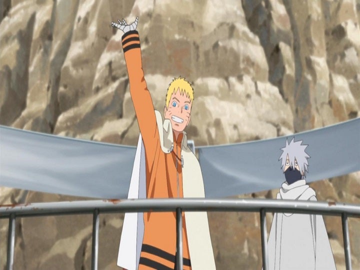 Naruto waving to the crowd after becoming Hokage.