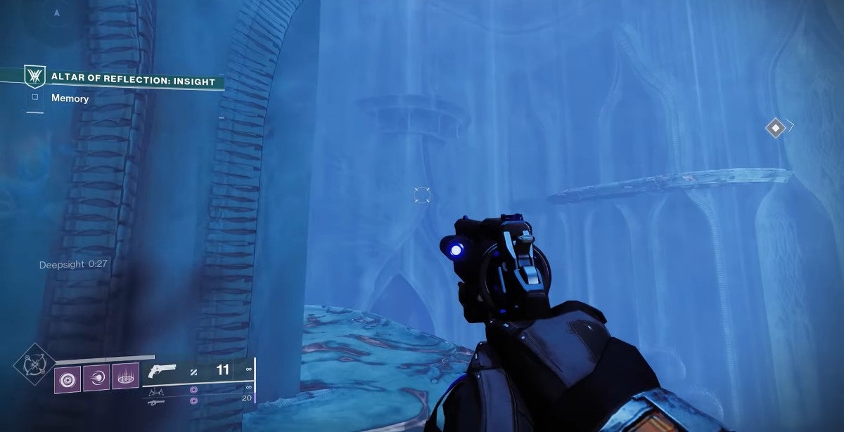 A player jumping up ledges in a blue room.