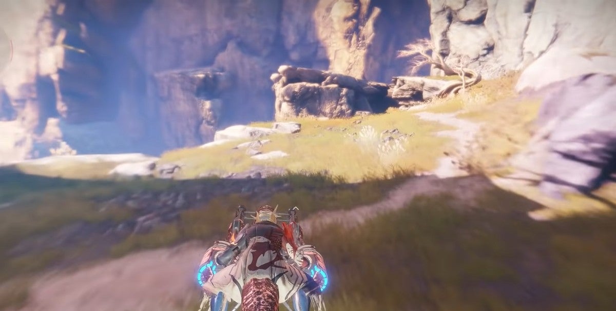 A player riding their sparrow towards a cliff.