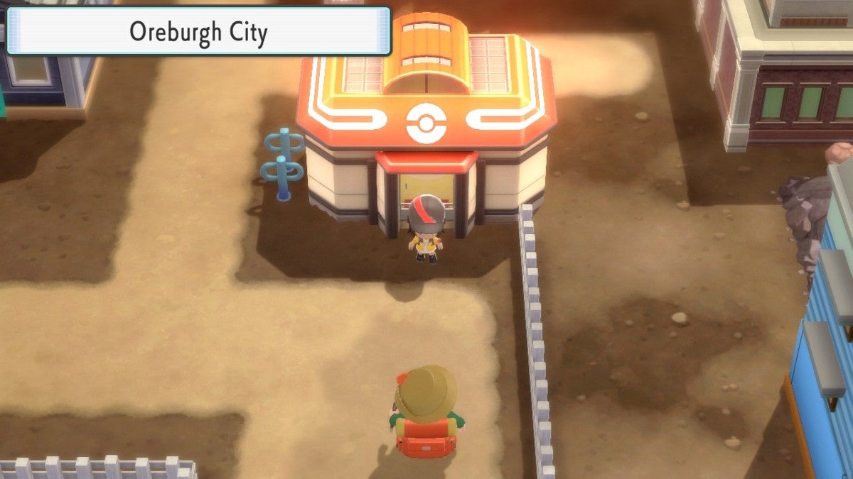 Player in front of the Pokémon Center in Oreburgh City.