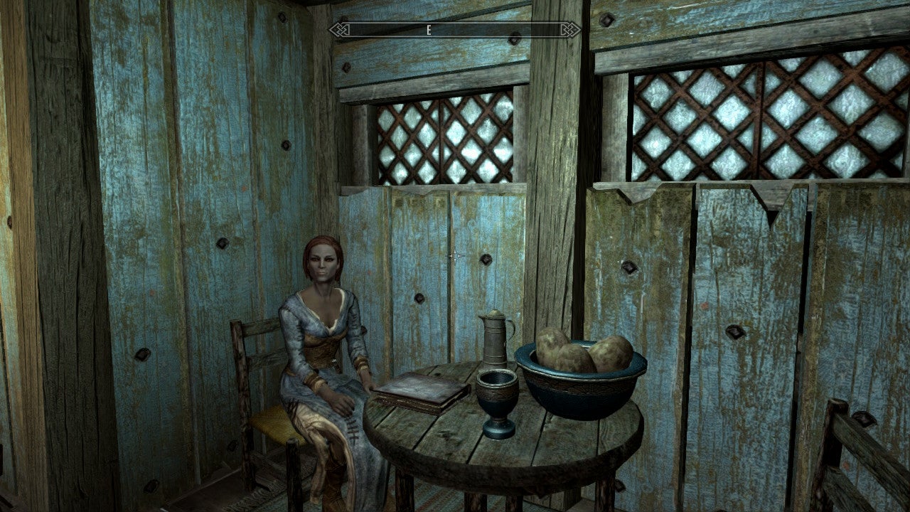 Ysolda sitting in her house.