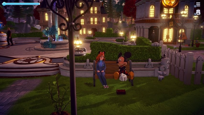 A character sitting on a bench with Mickey Mouse in Disney Dreamlight Valley