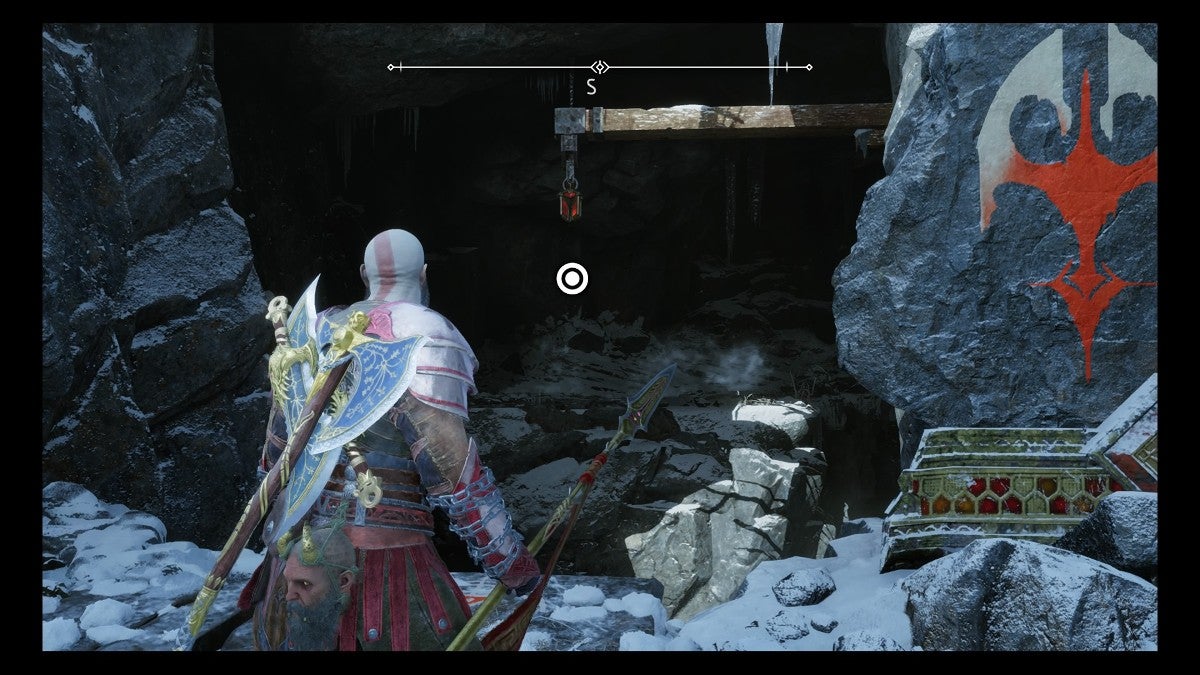 The God of War looking at a Grappling Hook.