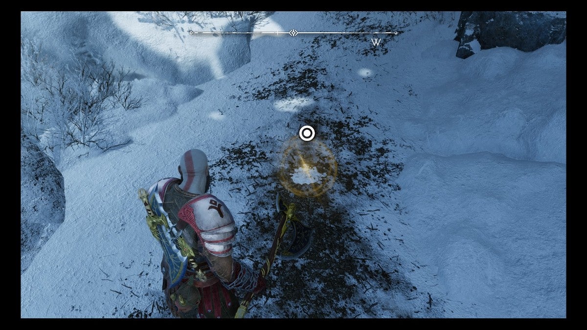 Kratos looking at a button prompt to uncover treasure.