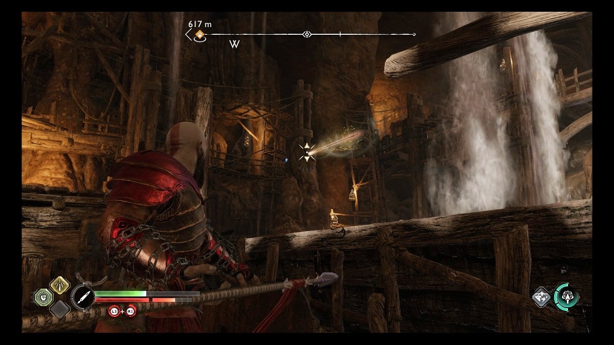 Kratos throwing a spear into a pillar.