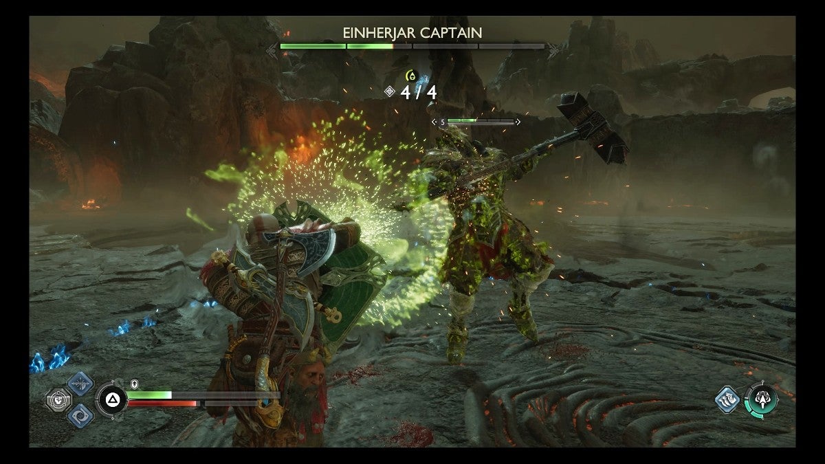 Kratos using a shield strike on the Einherjar Captain.