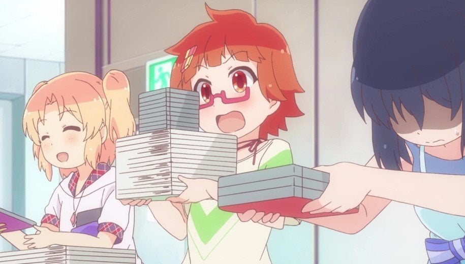 The girls from Stella no Mahou selling their self-made game. 