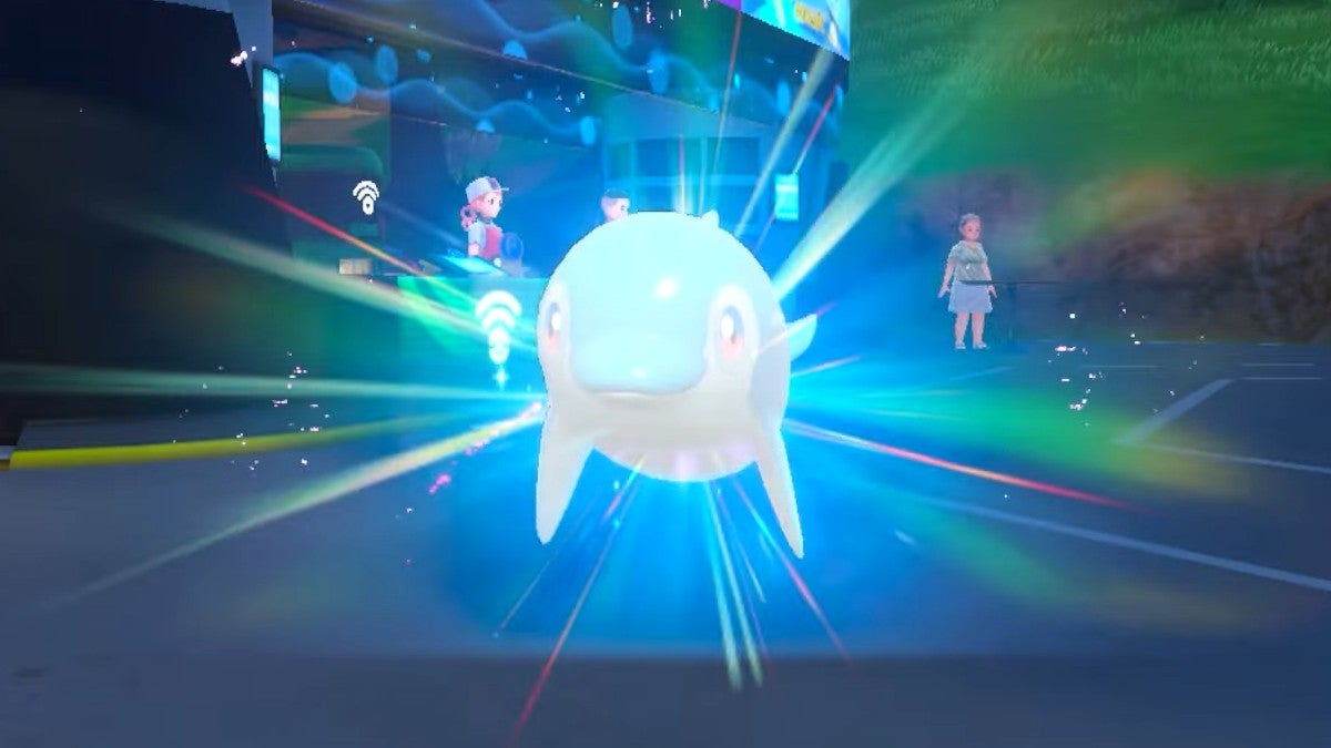 A Finizen evolving near a Pokémon Center.