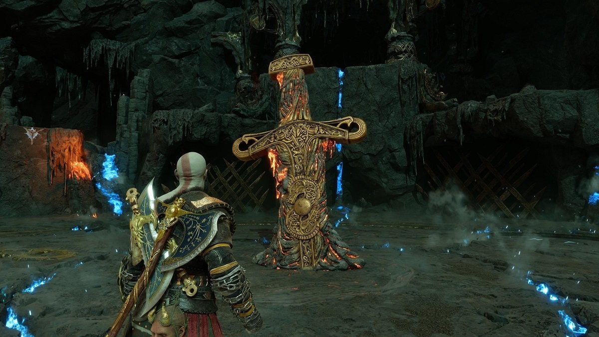 Kratos standing next to the giant sword in The Crucible.