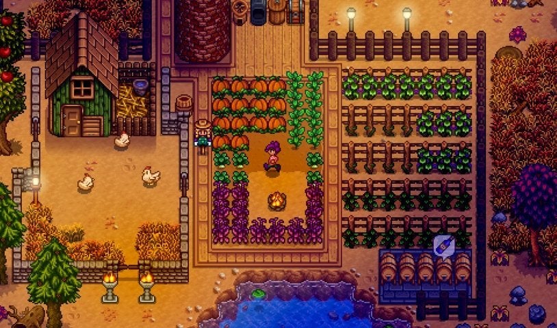 A character farming Fall crops in Stardew Valley