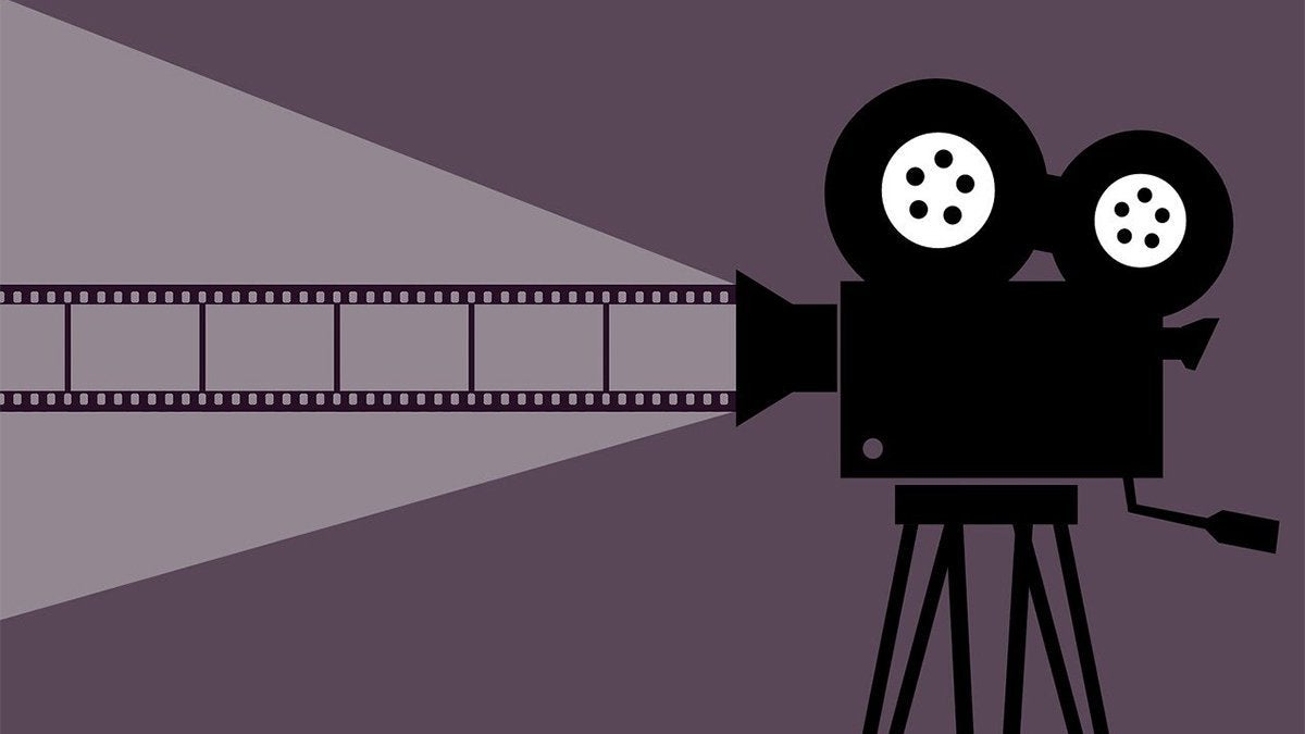 An illustration of a film camera with a strip of film coming out of the lens.