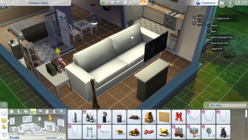 An enlarged sofa in a house in The Sims 4
