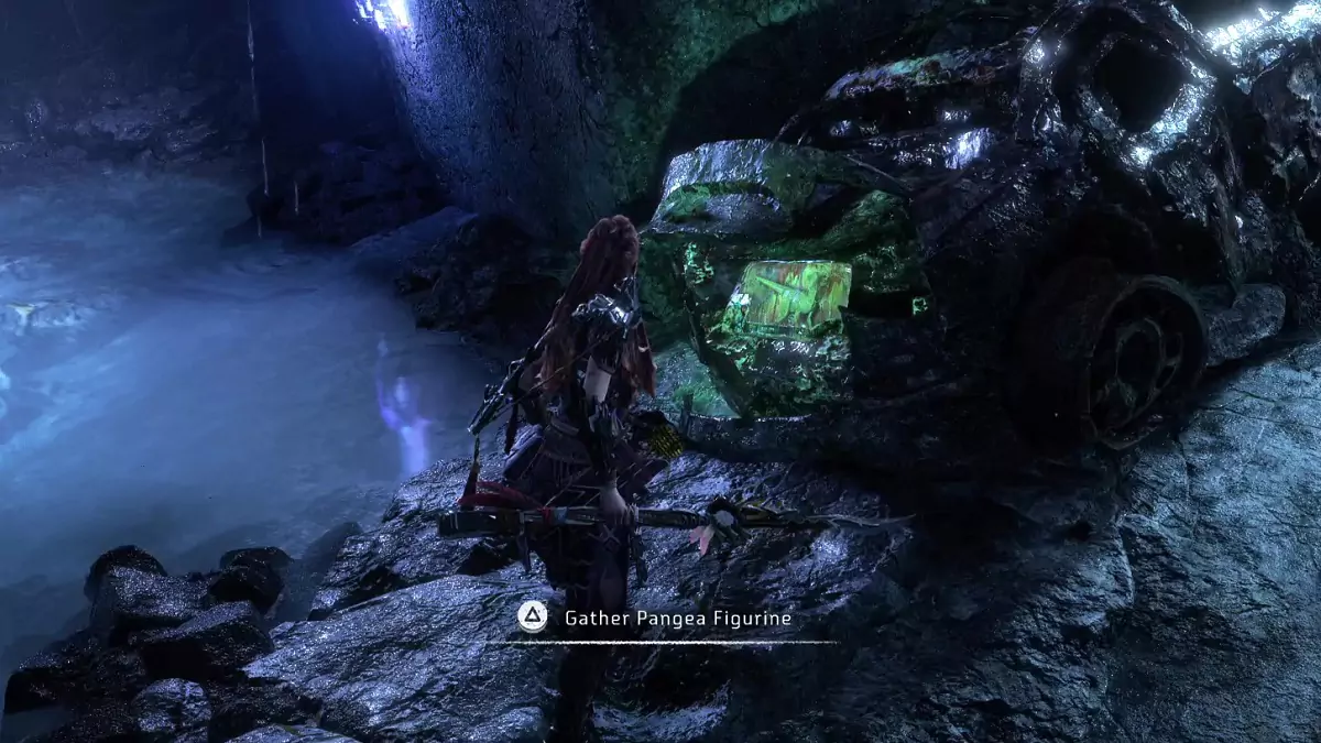Picking up a Pangea Figurine in Horizon Forbidden West Burning Shores.