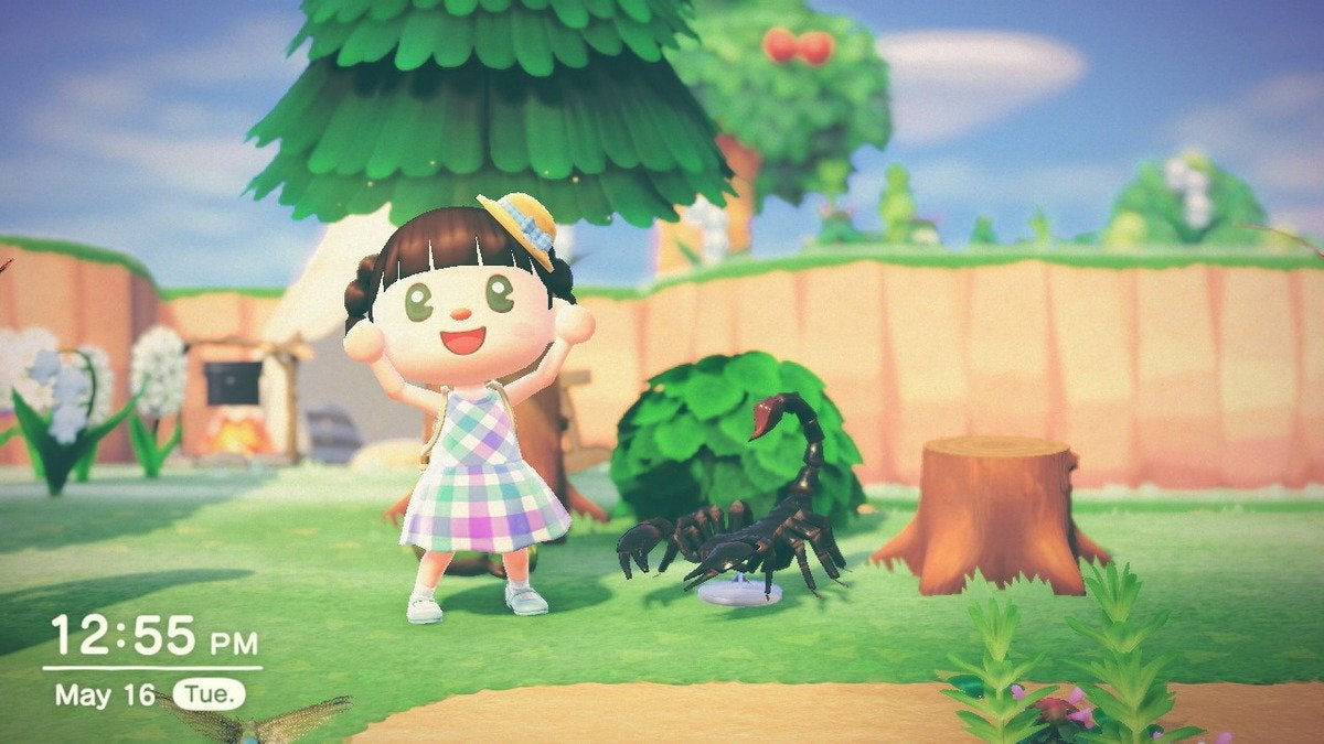 A player character next to a scorpion statue in Animal Crossing: New Horizons.