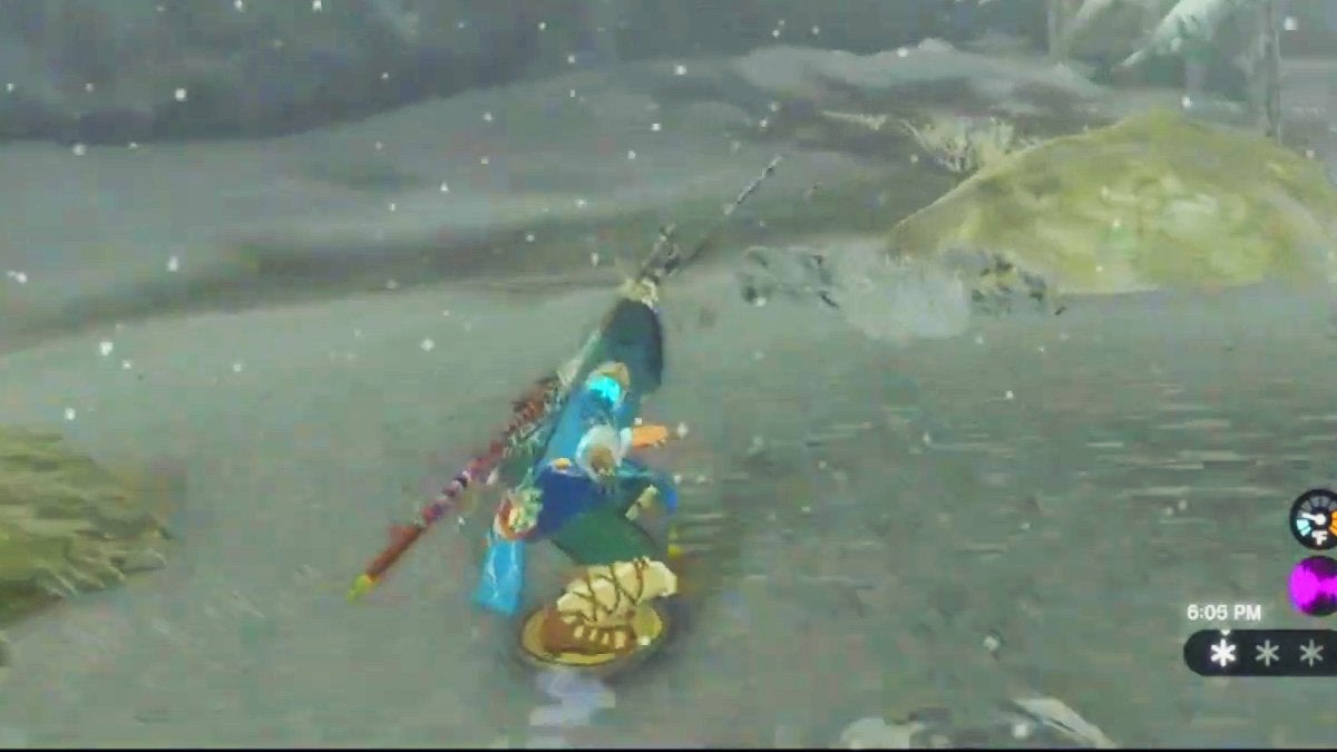 Link surfing down a slope on his shield in The Legend of Zelda: Tears of the Kingdom.