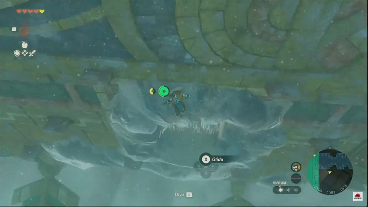 Link gliding down to a hole in the Wind Temple encrusted with ice.