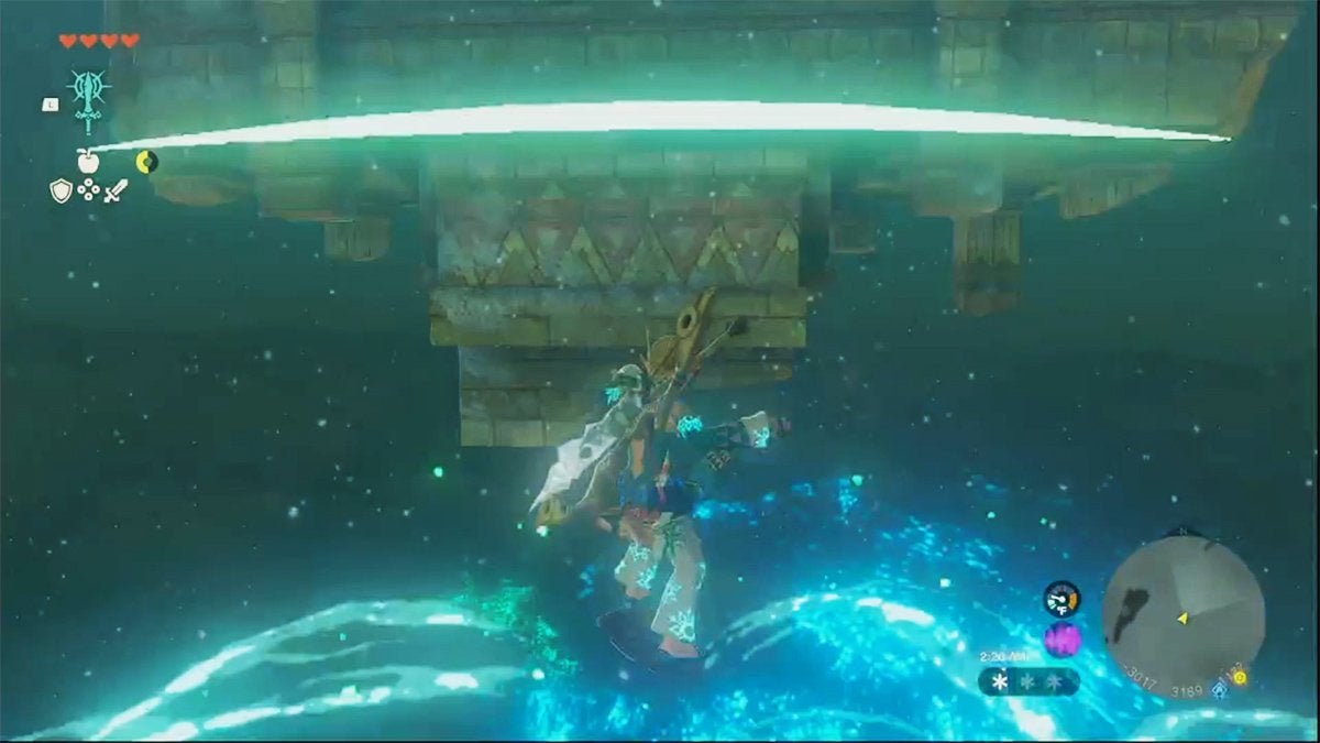 Link surfing on his shield in the air after bomb jumping. There's a bluish-green explosion under him.