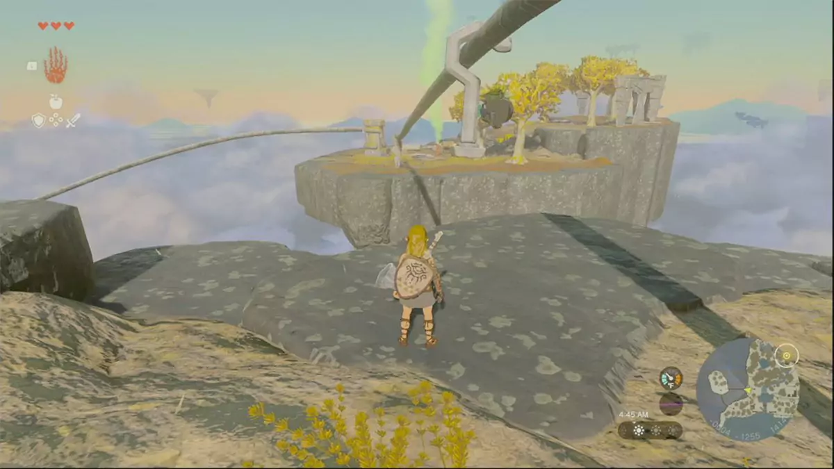 Link helping a Korok use a zipline to get across a big gap.