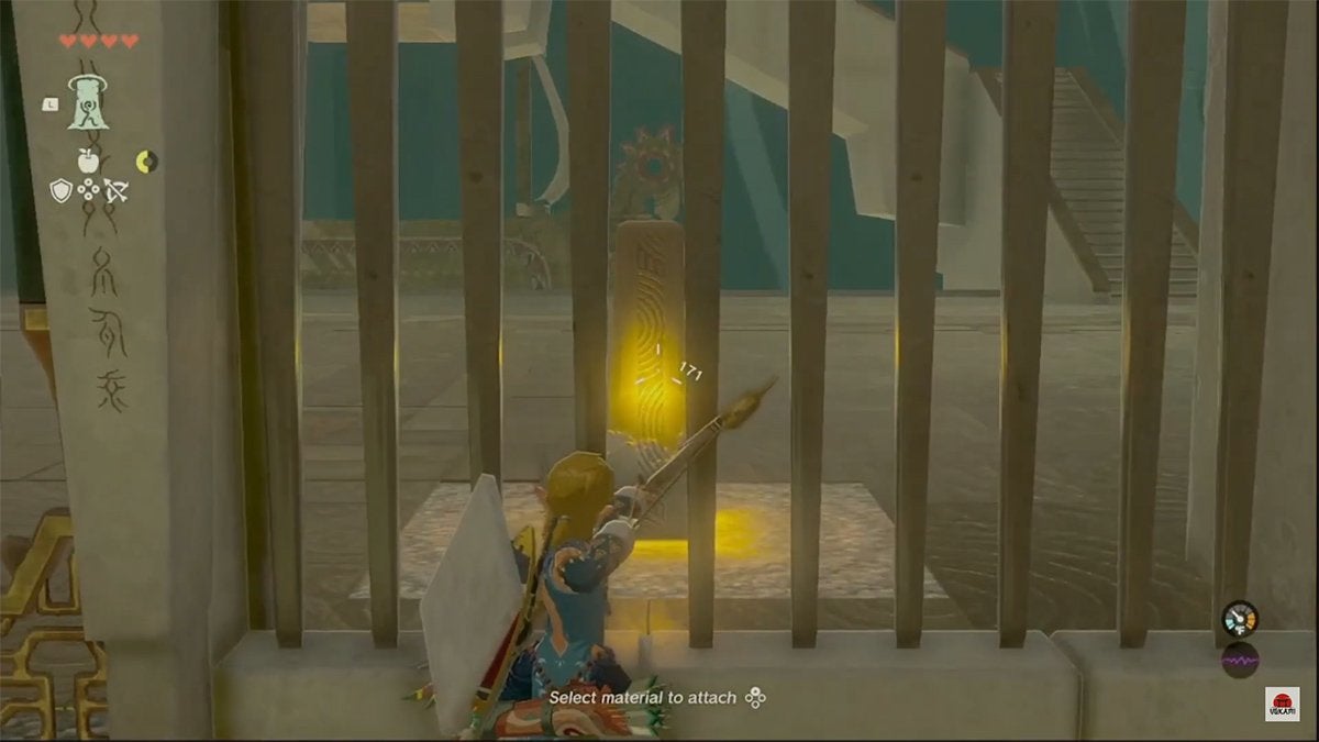 Link aiming his bow and arrow at an inactive yellow switch through some iron bars.