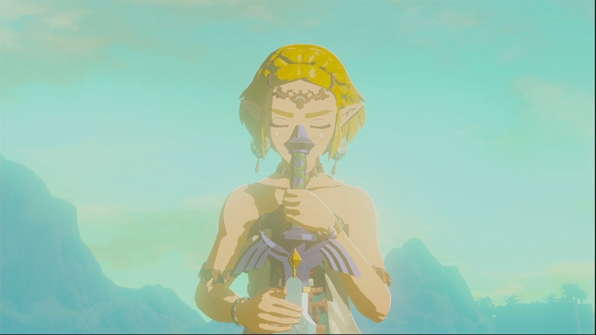 Princess Zelda holding a broken Master Sword in The Legend of Zelda: Tears of the Kingdom.