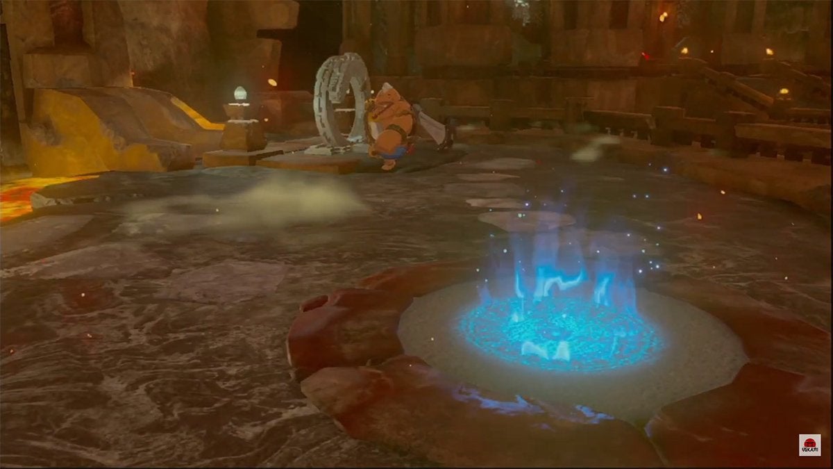 Link activating the fast travel point at the center of the Fire Temple.