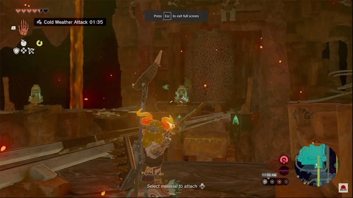 Link aiming at a bell switch across a gap in the Fire Temple.