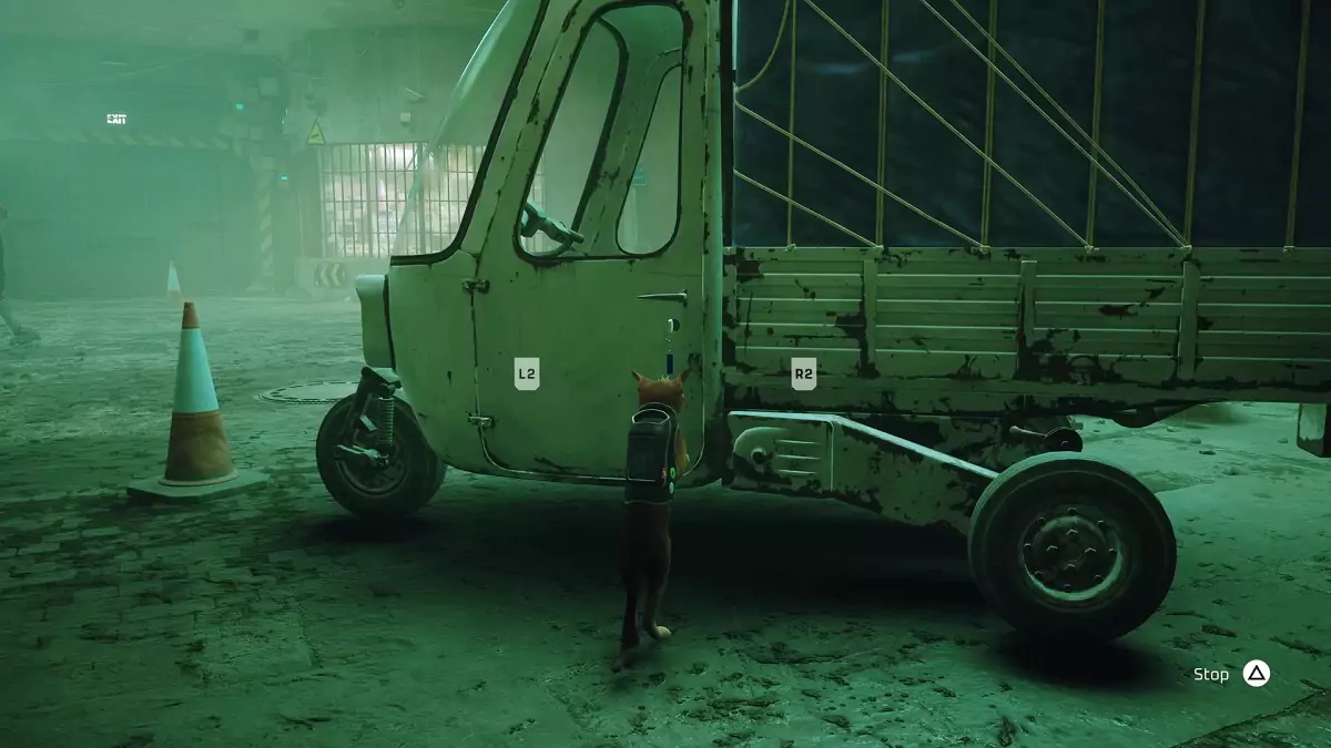 The Stray cat interacting with a set of keys in the left-side door of a truck.