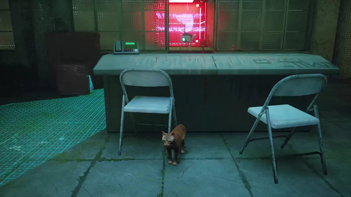 The Stray cat hiding from a drone behind a console.