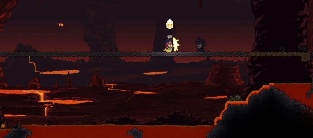 A player standing in the Underworld with Lava nearby.