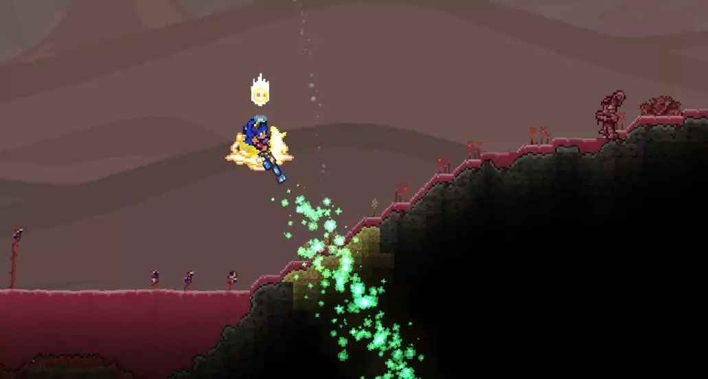 A Terraria player spraying the Clentaminator Green Solution to remove Crimson from their desert biome. 