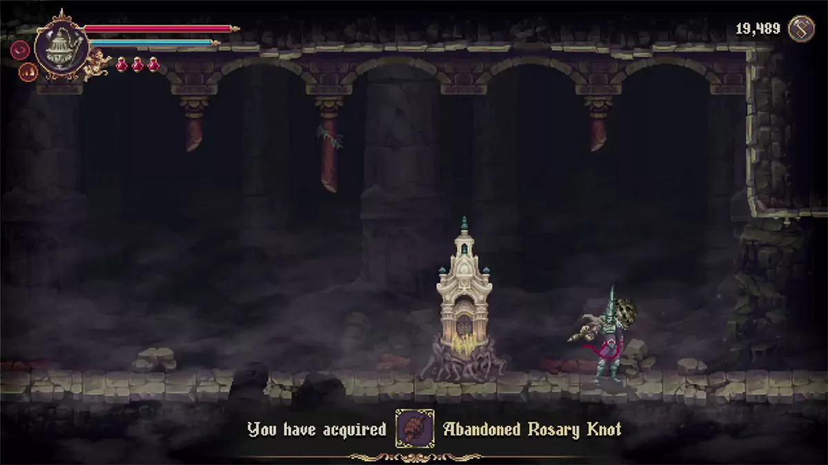 The player picking up the first Abandoned Rosary Knot in the game.