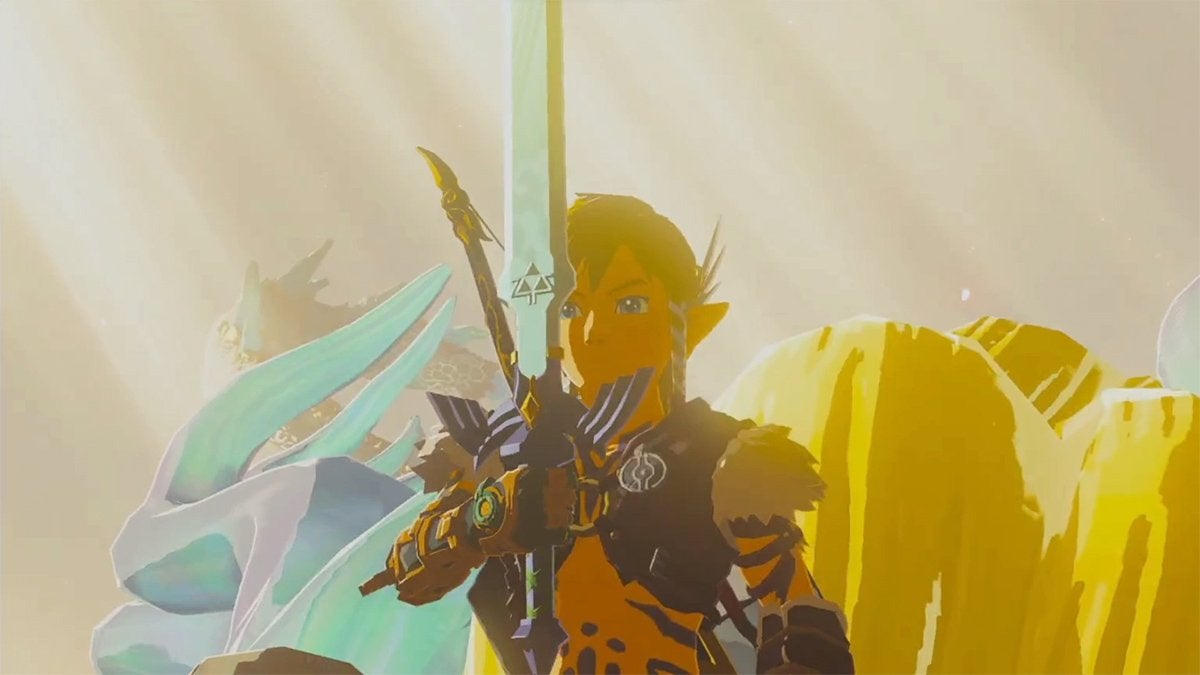 Link holding the Master Sword while standing on the head of the Light Dragon in The Legend of Zelda: Tears of the Kingdom.