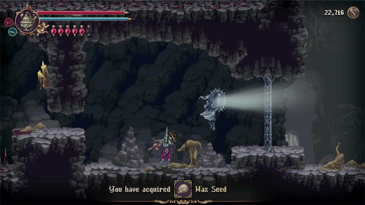 The player picking up a Wax Seed in the Labyrinth of Tides.