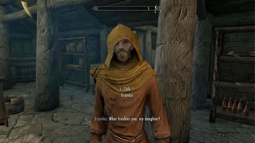 Erandur asking the player what's wrong whilst inside an inn in Skyrim
