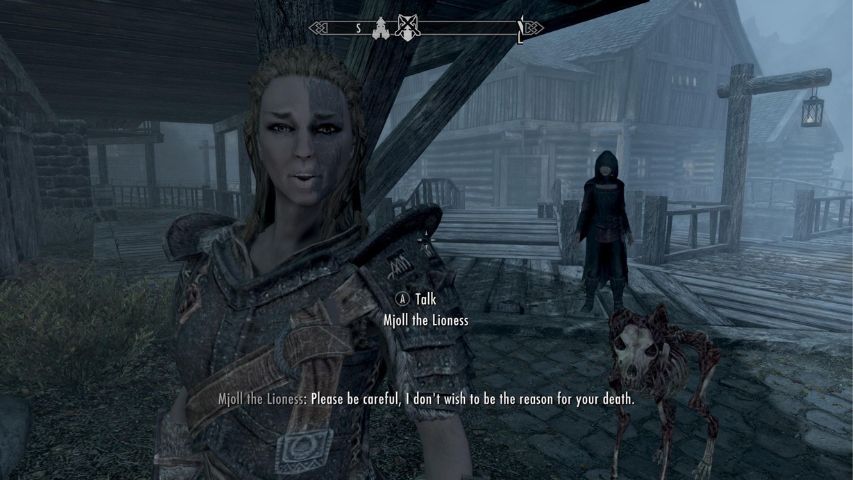 Mjoll the Lioness from Skyrim warning the player to be careful during a conversation in Riften.