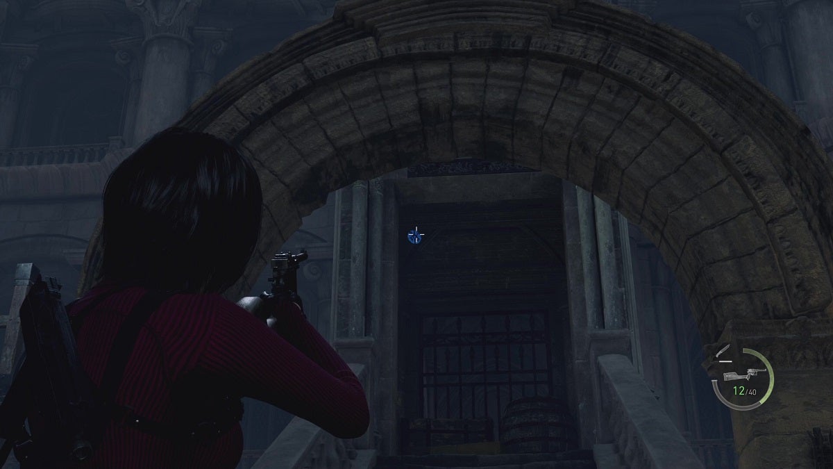 Ada aiming at a blue medallion past an archway.