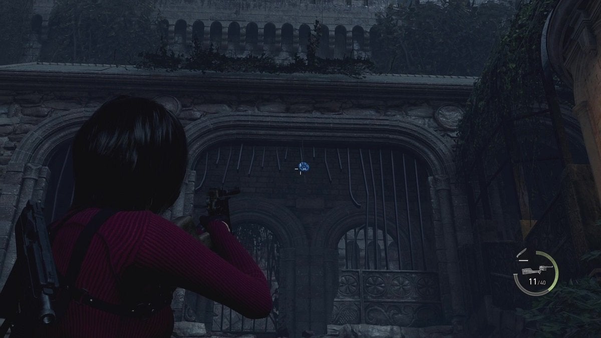 Ada aiming at a Blue Medallion within the top of a broken gate.