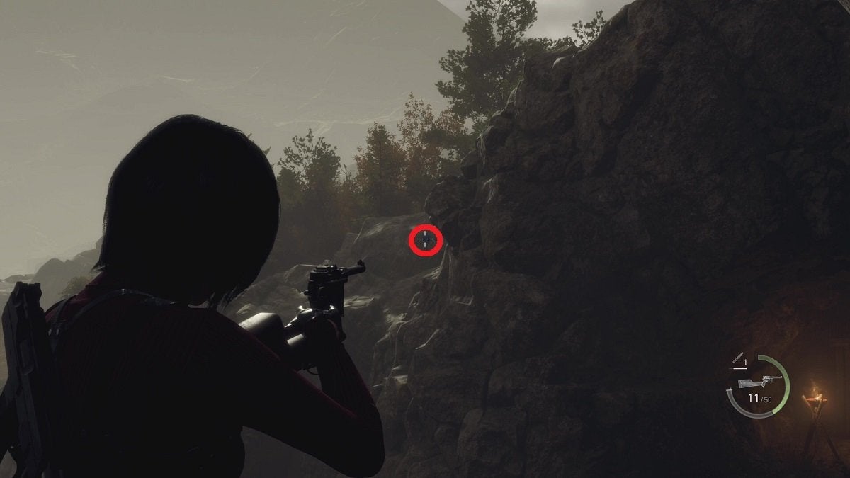 Ada aiming at a Blue Medallion in the Cliffside, with the medallion highlighted by a red circle.