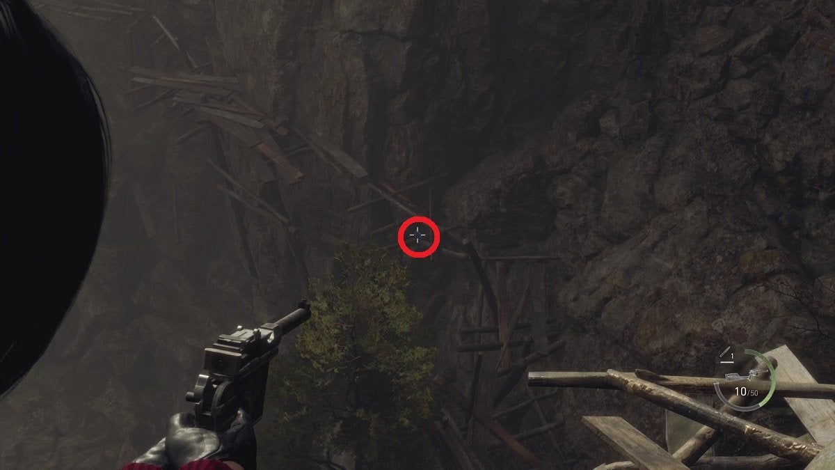 Ada aiming at a Blue Medallion in the Cliffside, with the medallion highlighted by a red circle.
