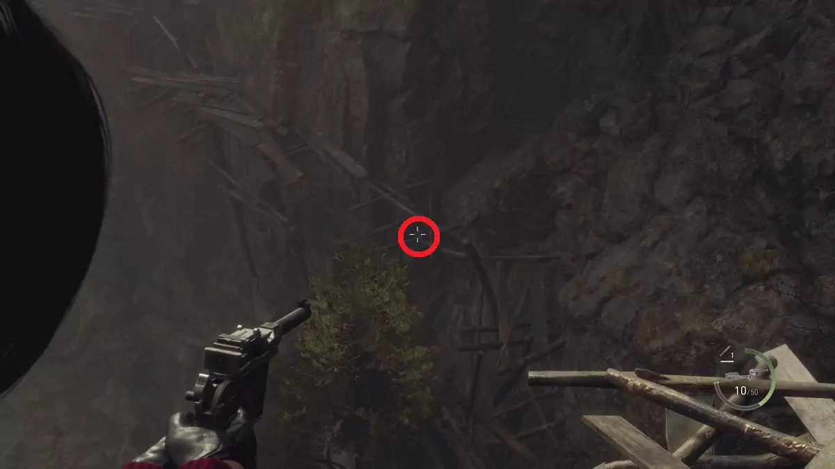 Ada aiming at a Blue Medallion in the Cliffside, with the medallion highlighted by a red circle.