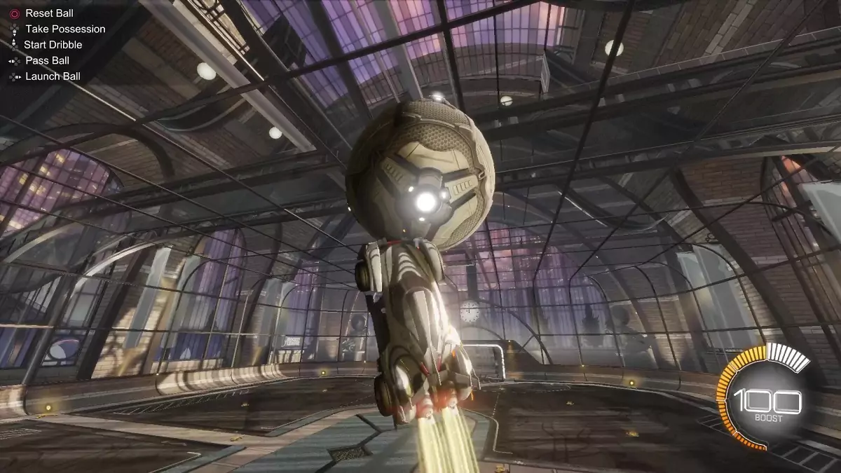 The player touching the ball mid-air in Rocket League.