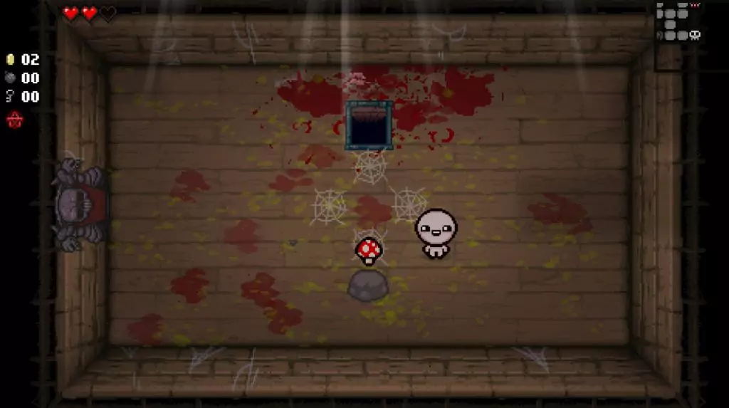 A player standing to the right of a Magic Mushroom powerup in Binding of Isaac: Rebirth.